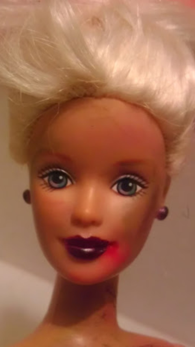 Darker lipstick with red in the corner of Barbie's mouth signifies a freshly eaten meal. Light blue smudges create bruises easily.  Green smudges catch the light.