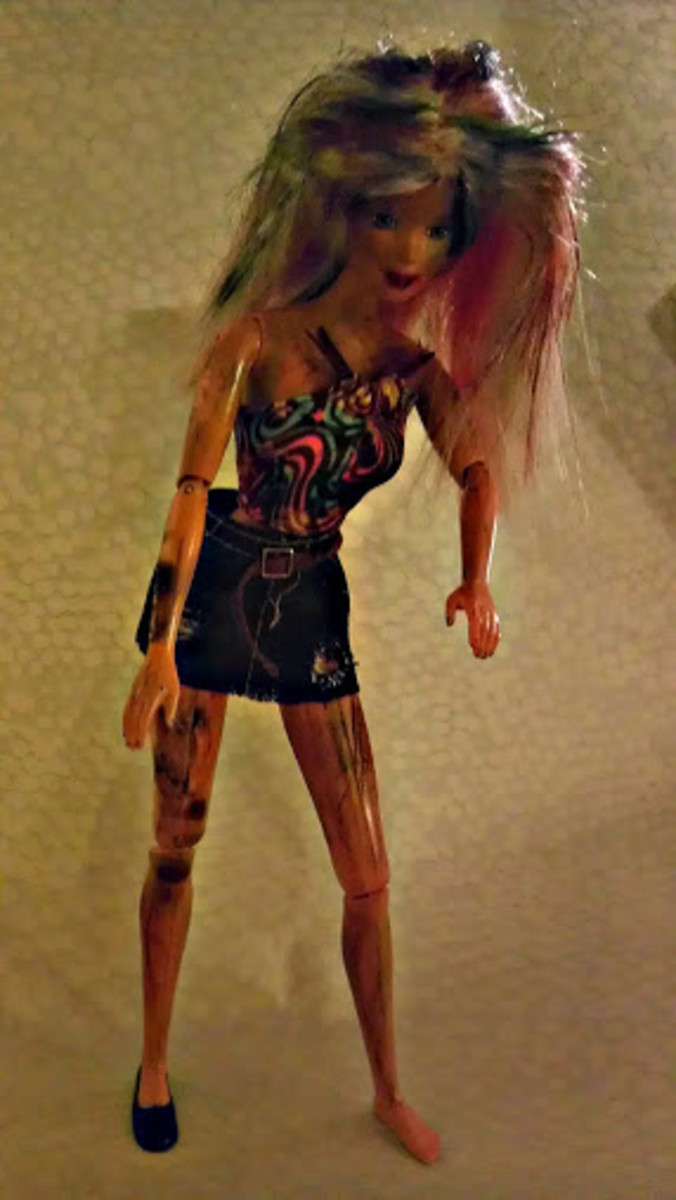 Barbie, a lovely zombie. She stands on her own, but she did lose a shoe.  Probably from running after her next meal!