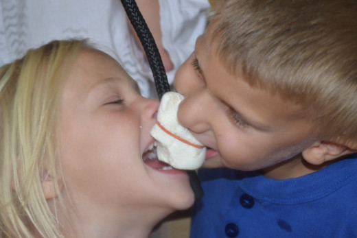 Children enjoying a marshmallow eating contest