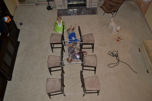 Using a rope and chairs, create a chair maze and let the kids challenge themselves by crawling through 