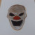 Titanium White watered down wash over the entire clown face.