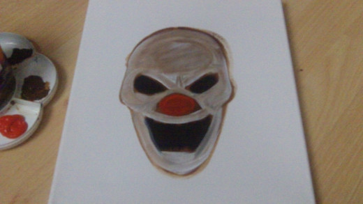 Titanium White watered down wash over the entire clown face.