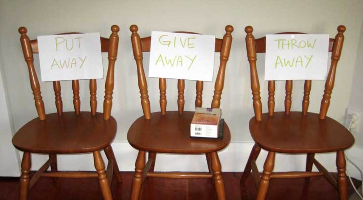 Stick the three labels: Put Away, Give Away and Throw Away on chairs or boxes.