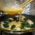 Adding egg to spinach and potato Adding egg to spinach and potato