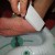 Using pumice stone to sloughs off dead skin from heel Using pumice stone to sloughs off dead skin from heel