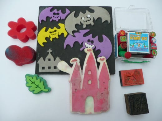 From left: sponge stamps, foam stamps, rubber stamps. Bottom right is a wooden stamp. 