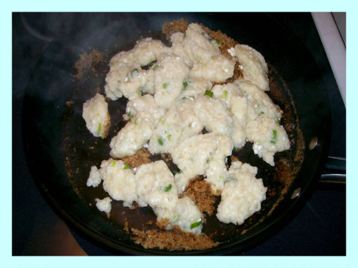 Drain dumplings and toss with toasted bread crumbs.  Source:  Sharyn's Slant