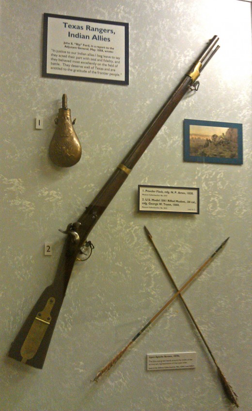 A ball and powder percussion rifle and arrows from Lipian Apaches, who cooperated with the Texas Rangers.