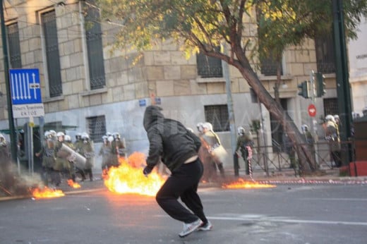 Sometimes protesters fight back such as in this anti-austerity protest in Athens Greece.