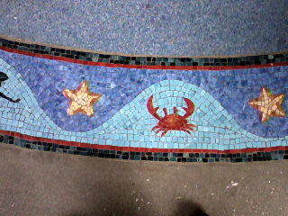 Floor mosaic at the entrance.