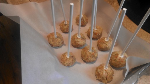 Cake pops with sticks inserted, ready to freeze