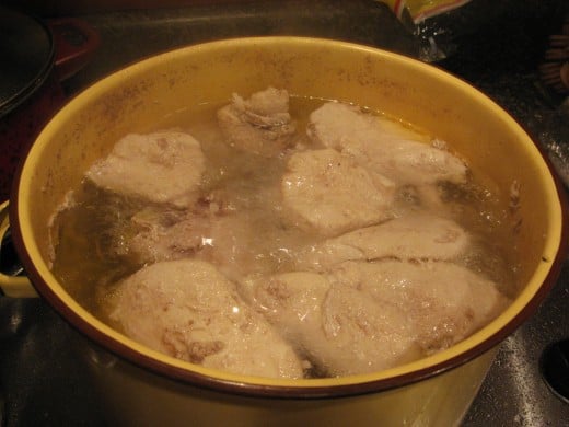 Boil chicken in salted water.
