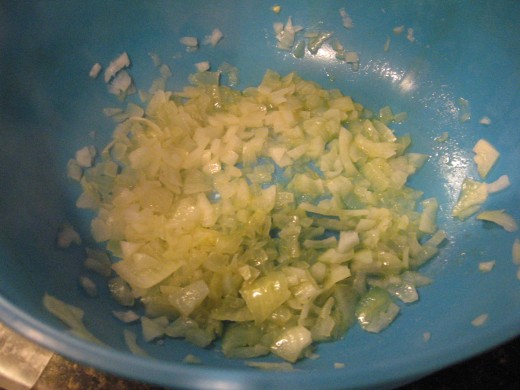 Heat onion, garlic, and butter in microwave.