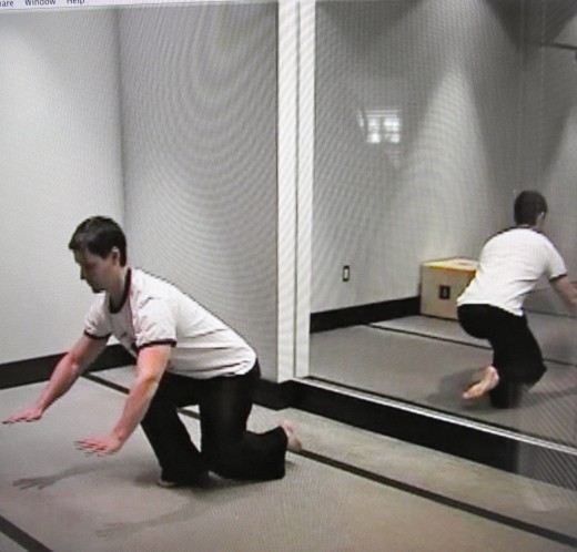 Airplane/Free Leg Behind Squat-Screen shot of Bodyweight Exercise Revolution's Adam Steer.