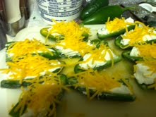 Top the cream cheese with approximately 1 tsp of sharp shredded cheese or mexican blend cheese.