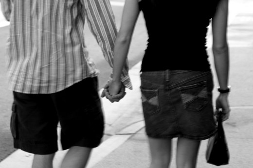 Couple holding hands