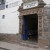 When you see the blue doorway this is your entrance through to the bakery. The entrance is decked with peruvian paintings
