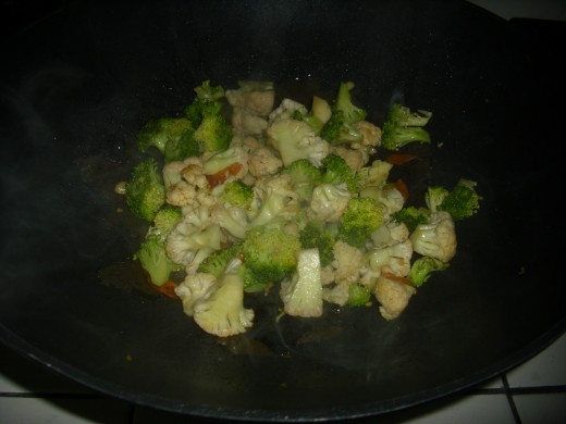 Stir fried broccoli and cauliflower with garlic and tomatoes.