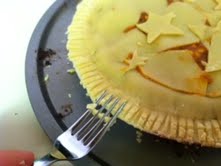 Use a fork to crimp the edges of the top crust and the bottom crust together.