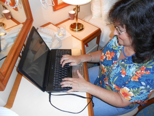 The author, taking a break from cruising fun to work on a hub in my stateroom! This was on the cruise to Hawaii... notice the shirt!