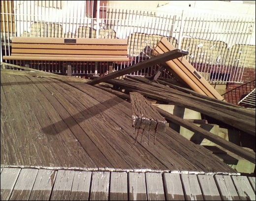 Memorial benches sinking into wrecked boardwalk