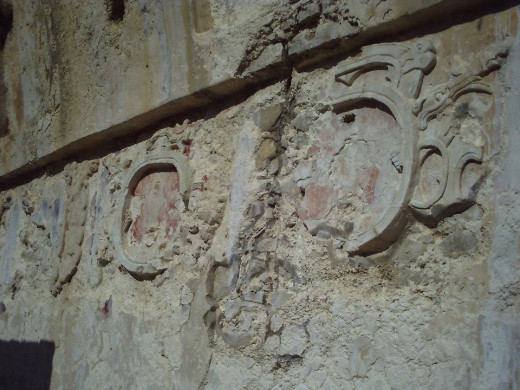 Stucco carving still on the walls of the Palacio with remnants of red coloring.  