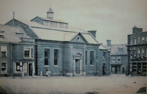 Photograph of North side of Market Place, Aylesham, Norfolk in 1857. Location of the Town Hall .