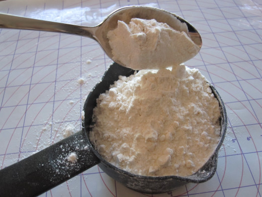 Gently drop the flour into a measuring cup