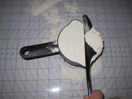 Remove excess flour with the edge of a knife