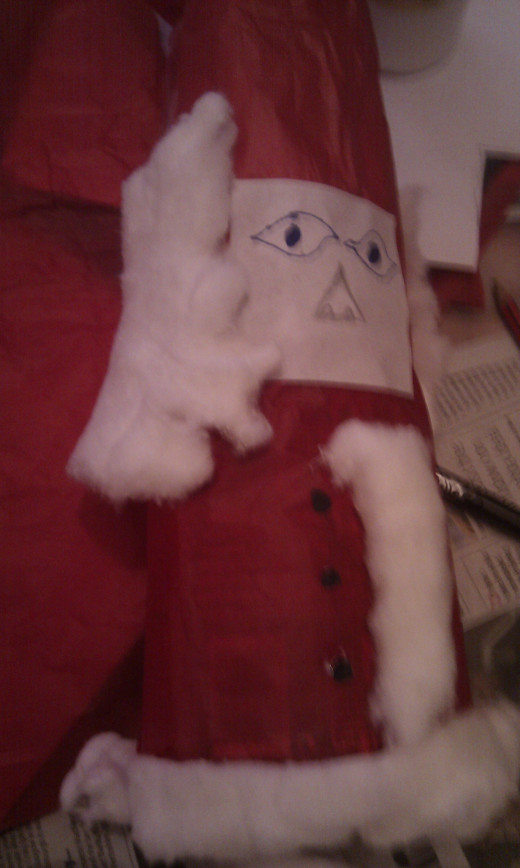 Glue on the face and finish with cotton wool