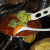 Adding in the zucchini to the spaghetti sauce Adding in the zucchini to the spaghetti sauce