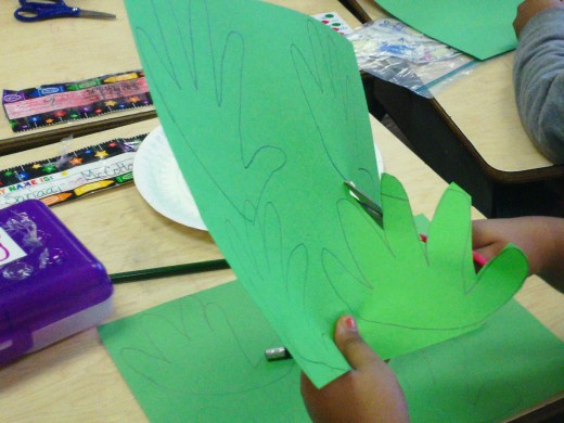 Cut out the hands carefully so that the fingers don't get cut off.