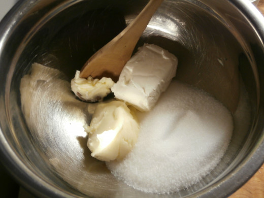 Cream butter together with cream cheese and sugar.