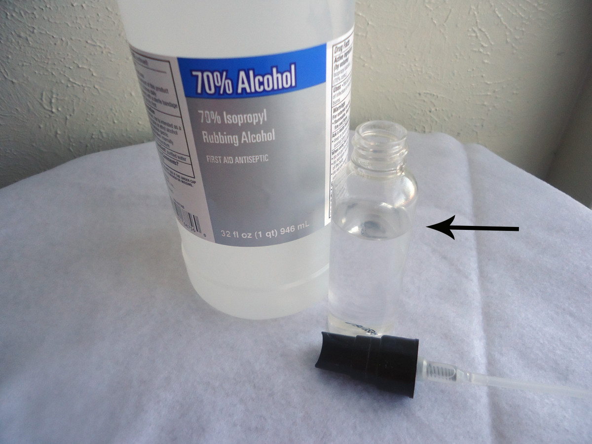 Put alcohol in small spray bottle.
