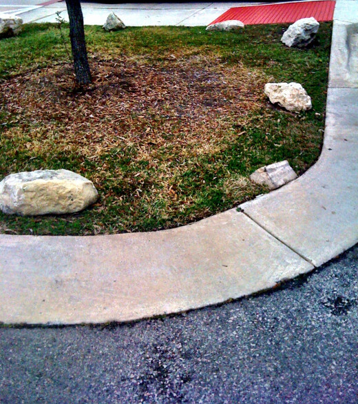 These stones say keep off the grass!
