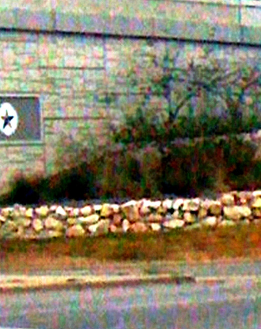 Stones stacked along a freeway wall for vegetation