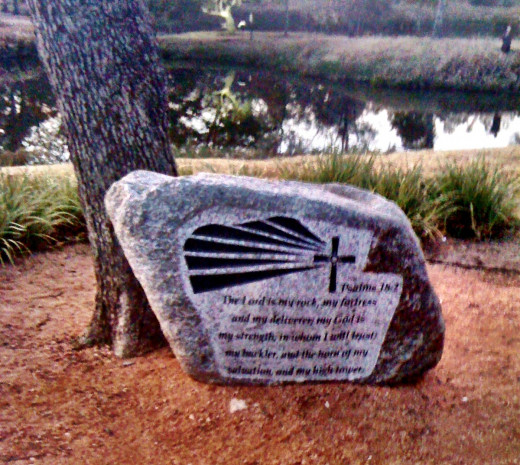 A rock with scripture in a church park area!
