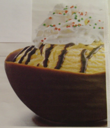 Chocolate bowl with ice cream and toppings