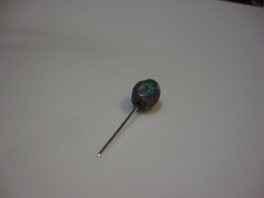 Large bead with bi-pin.