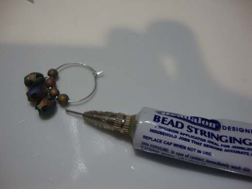 Add glue to keep beads in place.