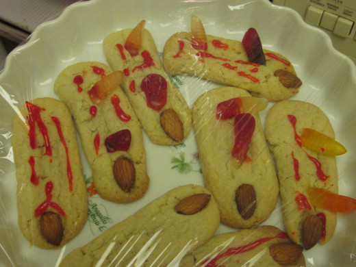 10. Fingers ..gummy worms and red gel and almond fingernails