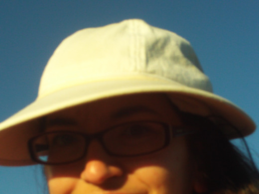 Self-portrait wearing a hat.