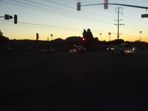 The silhouette of the Box Springs Mountains at sunset.