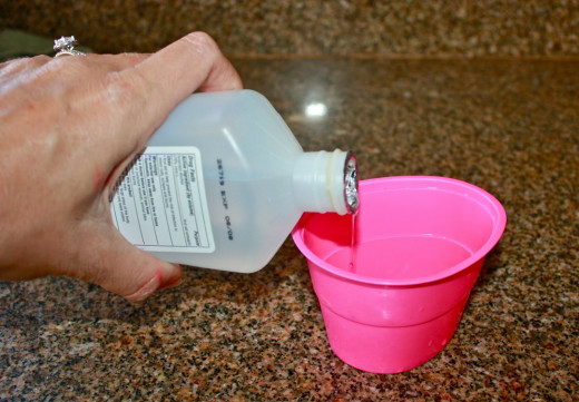 Pour a finger deep amount of Rubbing Alcohol into the cup