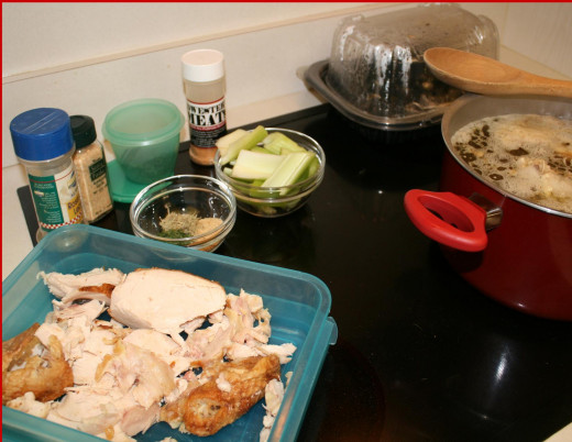 Remains of the rotisserie chicken and all the ingredients to make a great chicken soup broth