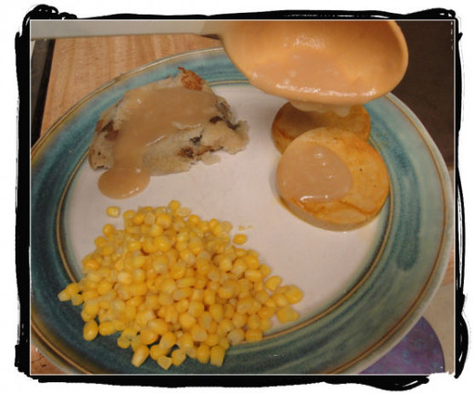 Gravy over mashed potatoes and tofu with a side of corn. Yummm!