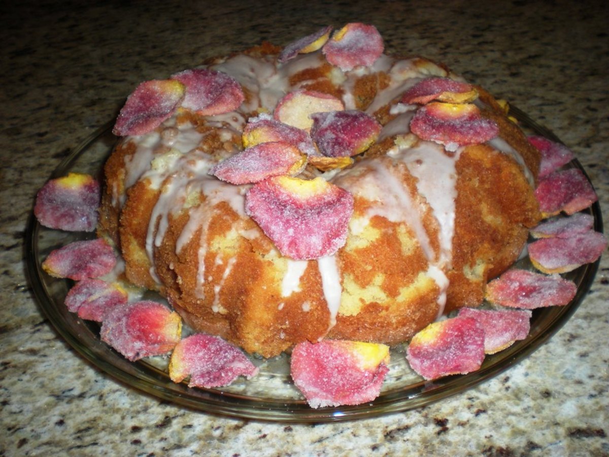 an almond cake with a rose water glaze and frosted rose petals.