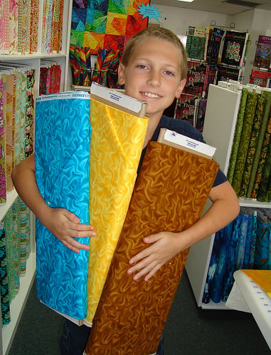 Choosing fabric at a quilt shop is fun, but it can be expensive.