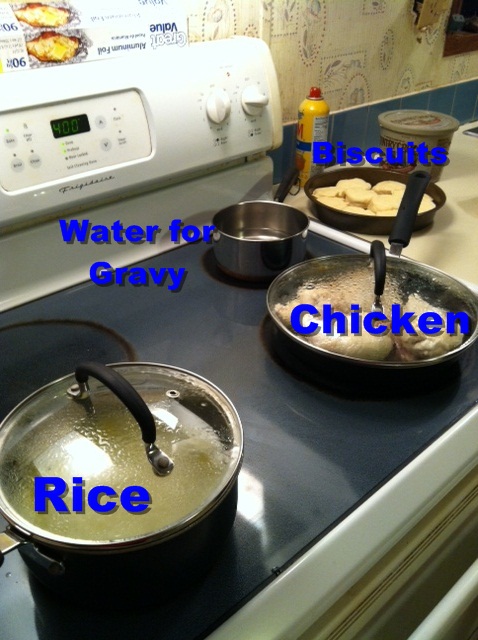 Rice and chicken cooking on stove. Water for the gravy and biscuits are waiting their turn. Credit: Chase Snoke
