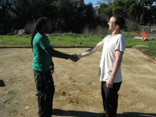Jamie and Glenn demonstrate a Kenpo technique called Broken Gift, against an unfriendly handshake in which the intent of the handshake is to distract and control so the attacker can deliver a punch.